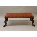 Large rectangular window seat raised on shell floral and claw front supports with carved cabriole