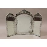 Venetian glass three fold dressing table mirror having sectional floral engraved borders (at fault),