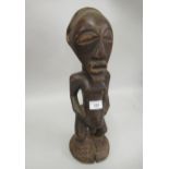 African carved hardwood fertility figure in the form of a standing man, 16ins high