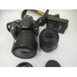 Nikon D5200 digital camera with two lenses, spare battery and charger