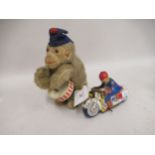 Mid 20th Century clockwork toy in the form of a monkey playing a drum, together with a small