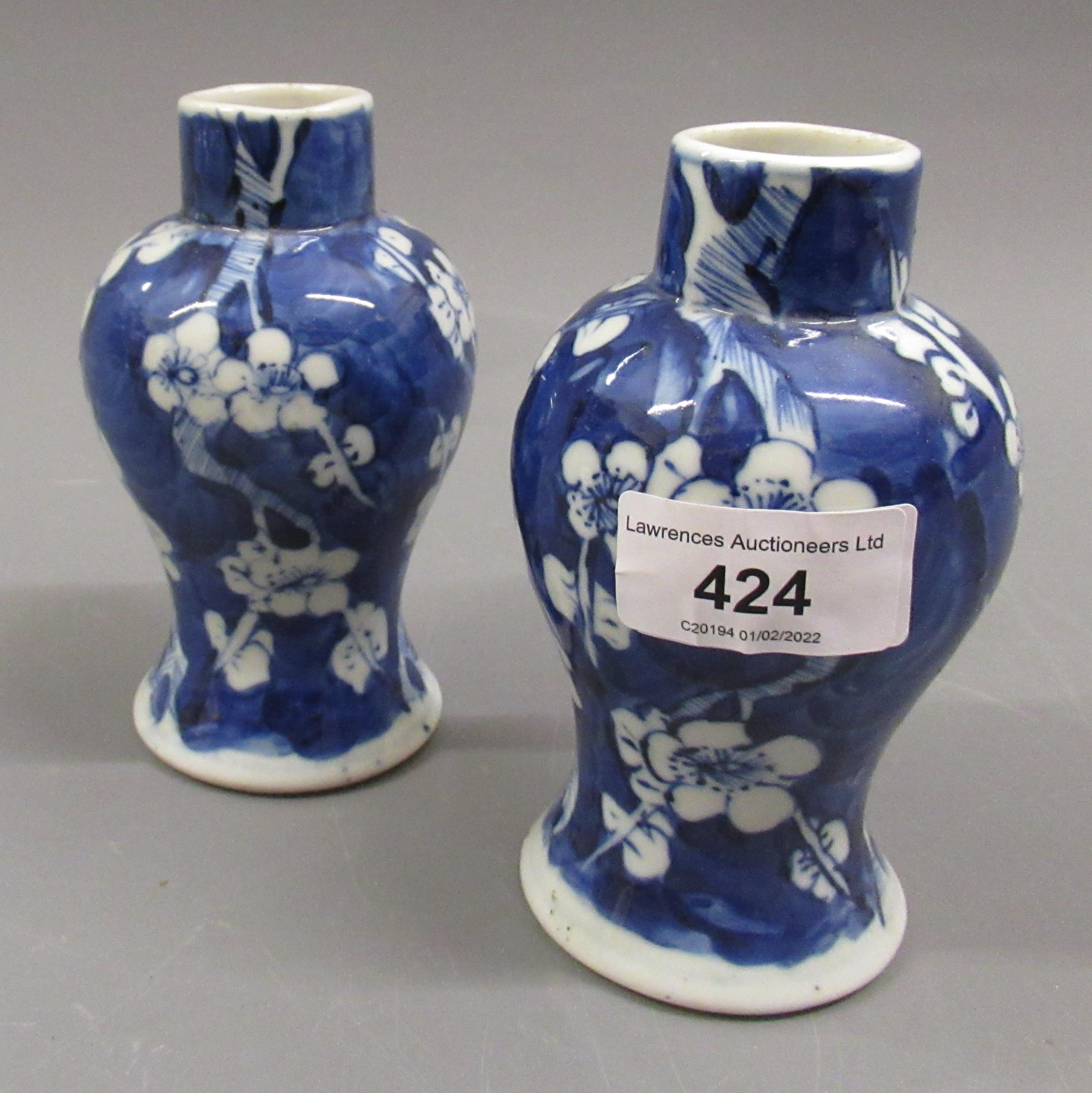 Pair of small Chinese prunus blossom decorated baluster form vases, signed with four character marks