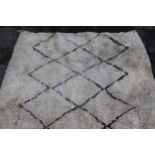 Berber carpet with dark lattice design on cream ground, 7ft x 4ft 10ins approximately