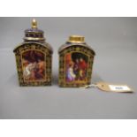 Pair of late 19th Century Vienna porcelain teapoys, painted with classical figures, (one lid