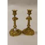 Pair of 19th Century French ormolu candlesticks, with cast decoration, 9ins high These are bronze.