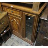 Reproduction marquetry inlaid side cabinet with a central drawer above a panelled door, flanked by