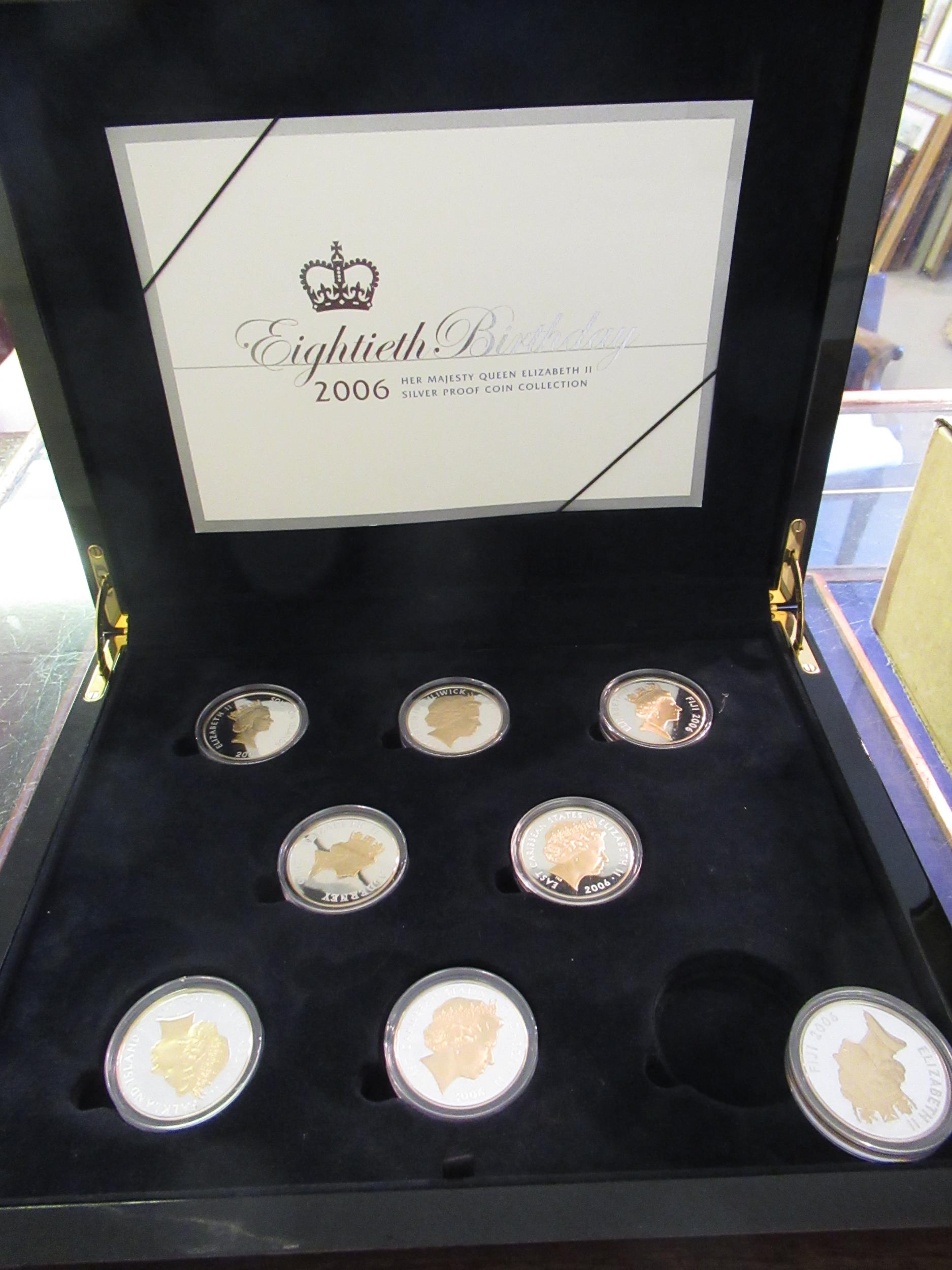 Silver proof coin set, Queen Elizabeth II 80th birthday, in presentation box and a reprinted ' The
