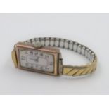 Ladies rectangular 9ct gold cased wristwatch, with mother of pearl dial on a gold plated strap