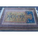 Small Indo Persian prayer rug of Turkoman design in shades of beige, blue and red, 5ft 2ins x 3ft