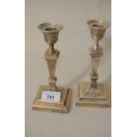 Pair of small London silver candlesticks of square fluted baluster form, 6.75ins high
