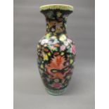 Reproduction Chinese Famille Noire baluster form vase decorated with flowers and dragons, 18.5ins