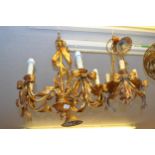 Modern gilt metal five light electrolier of ribbon design, 20.5ins high together with a similar,