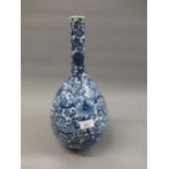 Chinese blue and white bottle vase with all-over floral decoration, 15ins high Rim crack otherwise