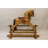 Good quality modern pine rocking horse on stand, by Stevenson Brothers No.172 and dated 1985,