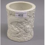 Chinese white porcelain brush pot having, all over decoration with sea monsters and fish, bearing