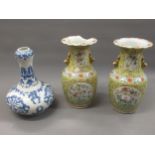 Pair of late 19th or 20th Century Chinese canton baluster form two handled vases, decorated with