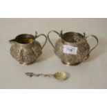 Burmese white metal cream jug and sugar bowl with spoon