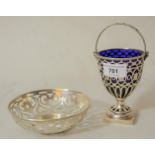 Small London silver bonbon basket with swing handle and blue glass liner in George III style,