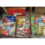 Three boxes containing a large quantity of Lego construction toys together with a Lego wooden box