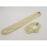 Two row uniform culture pearl necklace, with a 9ct gold gem set clasp, together with similar three