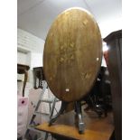 Victorian walnut and inlaid oval pedestal centre table on a cluster column support and quadruped