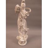 20th Century Chinese blanc de chine figure of a lady holding a basket of roses, 15.5ins high