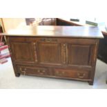 18th Century oak low mule chest, the hinged cover, having three fielded panel front and two short