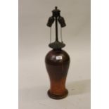 Mid 20th Century Continental pottery baluster form table lamp with patinated metal two branch