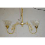 Art Nouveau style brass two branch ceiling light fitting, with clear glass shades