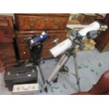 Meade Electronic Astronomical telescope with tripod, fitted case and cased set of interchangeable