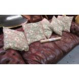 Five William Morris square cushions, golden lily design, together with a roll of vintage Sanderson
