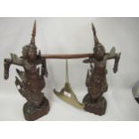 Thai prayer gong supported by two carved hardwood figures