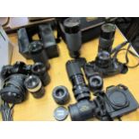 Canon EOS 500 35mm camera with various lenses, a Canon T80 35mm camera with various lenses and a