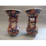 Pair of Japanese Imari flared rim vases, floral decorated in red and blue, (hairline crack to