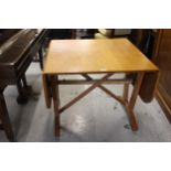 David Joel, Honey oak rectangular drop leaf side table, with crossover stretchers and twin splayed