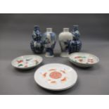 Pair of Chinese blue and white baluster form vases decorated with various figures (both at fault),