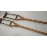 Pair of early 20th Century wooden and brass mounted crutches