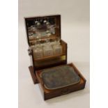 Good quality Edwardian mahogany shell inlaid tantalus, the hinged cover enclosing three cut glass