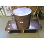 19th Century copper cylindrical urn and cover with brass tap, together with a copper warming stand