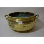 Chinese circular polished bronze large two handled censer with landscape decoration, 14ins diameter,