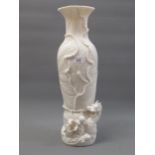 Large Chinese blanc de chine foliate design baluster form vase, the foot mounted with the figures of