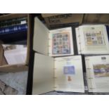 Eight albums containing a collection of World stamps