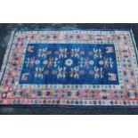 Small Turkish rug with stylised floral design on blue ground with borders, 4ft 10ins x 3ft 2ins