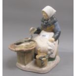 Bing & Grondahl porcelain group of a seated fish wife, 8.5ins high Good condition, no damage