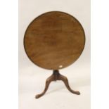 George III mahogany circular pedestal table, the tilt dish top above a baluster turned column