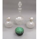 Pair of cut glass ball form perfume bottles with Continental white metal mounts, an Art Deco style