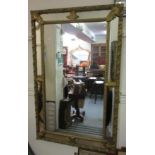 19th Century rectangular gilded composition cushion framed wall mirror, with sectional plate border,