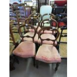 Set of six Victorian rosewood balloon back dining chairs with upholstered seats, raised on turned