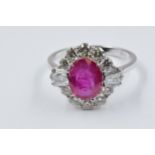 18ct White gold oval ruby and diamond cluster ring, the ruby approximately 2.14ct