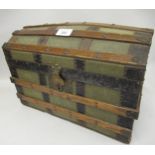 A doll's early 20th Century wooden and metal banded dome top trunk with part fitted interior